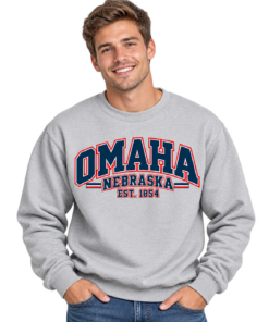 Smiling Man in Omaha Varsity Sweatshirt